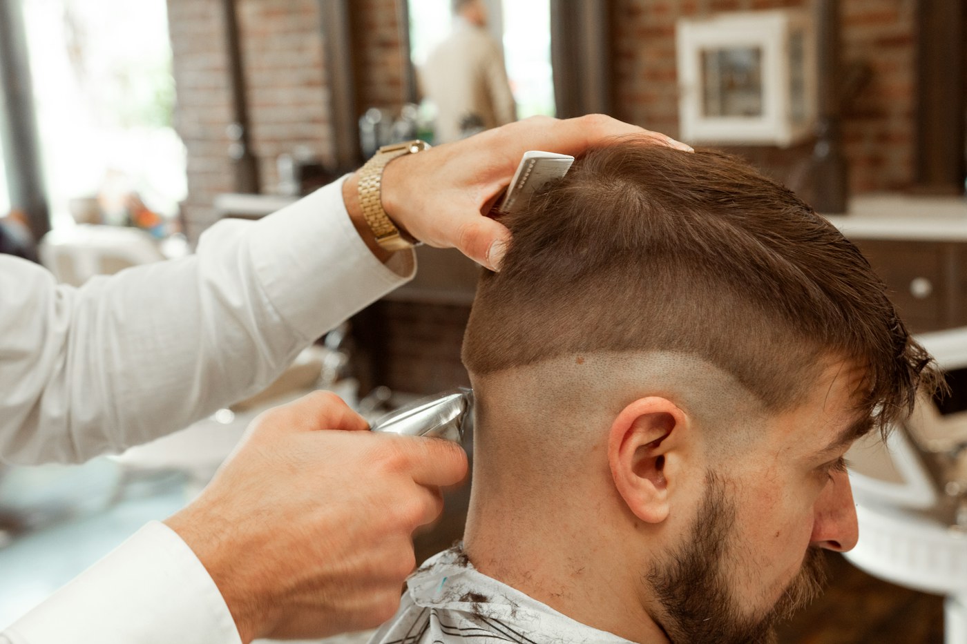 Illustrative image: Man receiving precision hair service