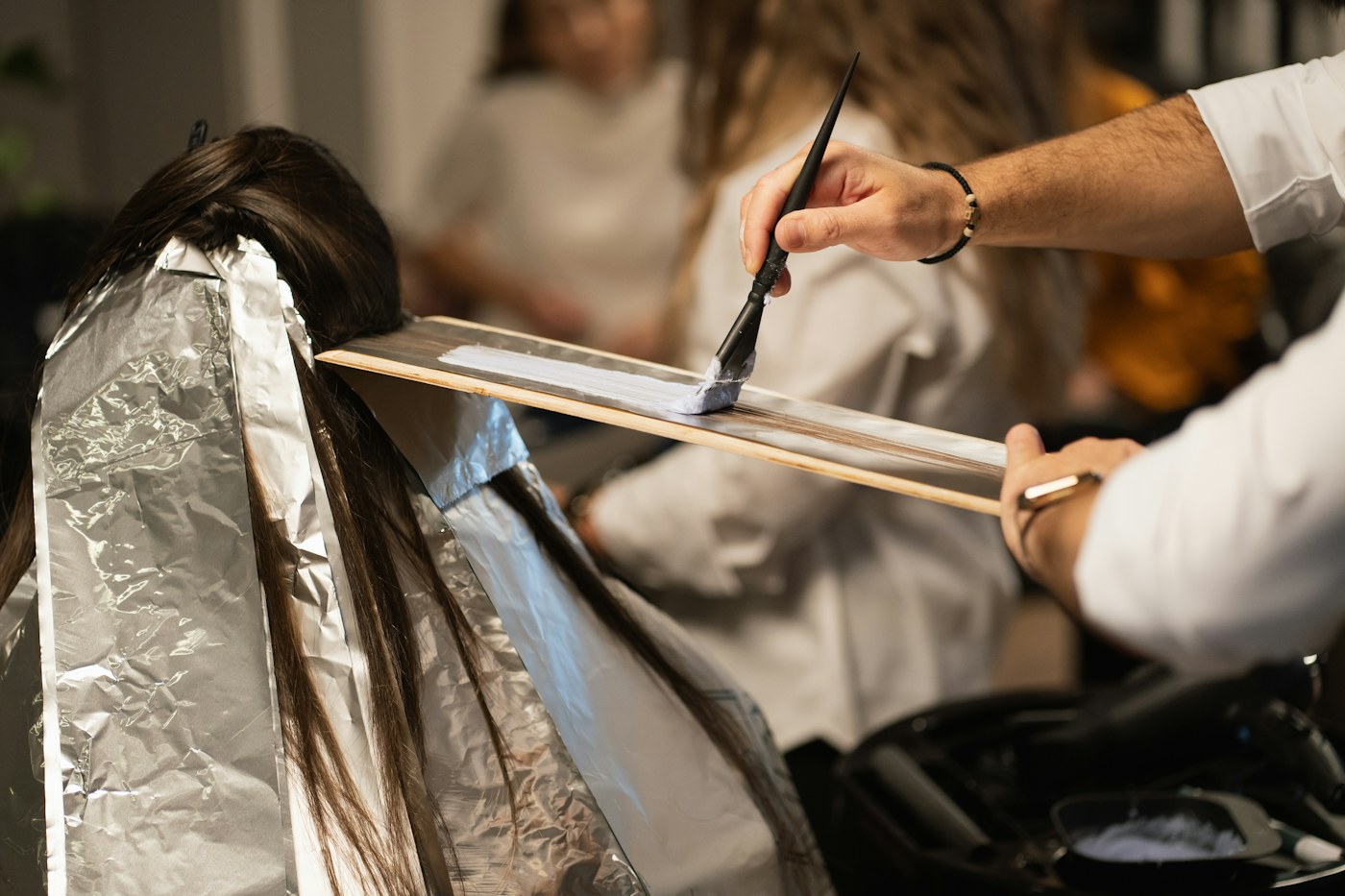 Illustrative photography: Stylist refining a client's hair