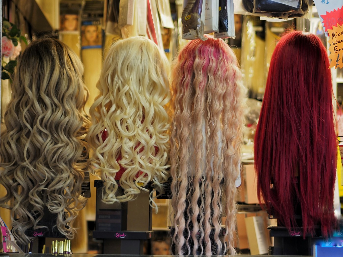 Illustrative photography: Wigs displayed for style comparison